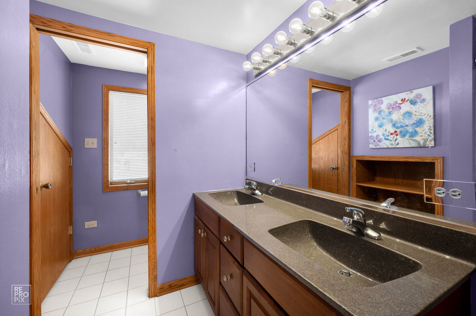 3235 192nd Street Lansing, IL 60438 - Photo 17 of 28 a bathroom with a sink double vanity and a mirror