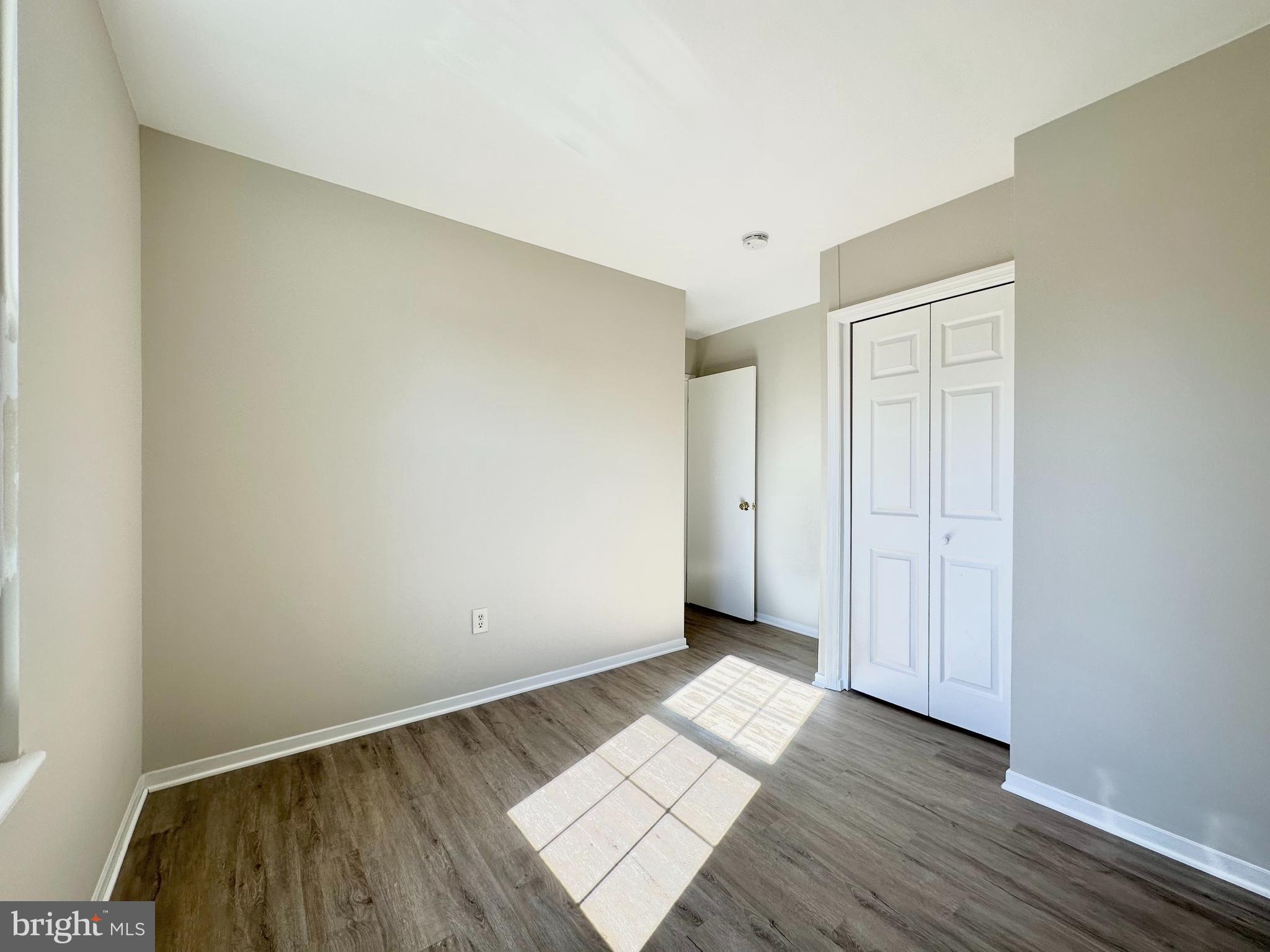 402 Carousel Court Gaithersburg, MD 20877 - Photo 24 of 29 a view of an empty room and wooden floor