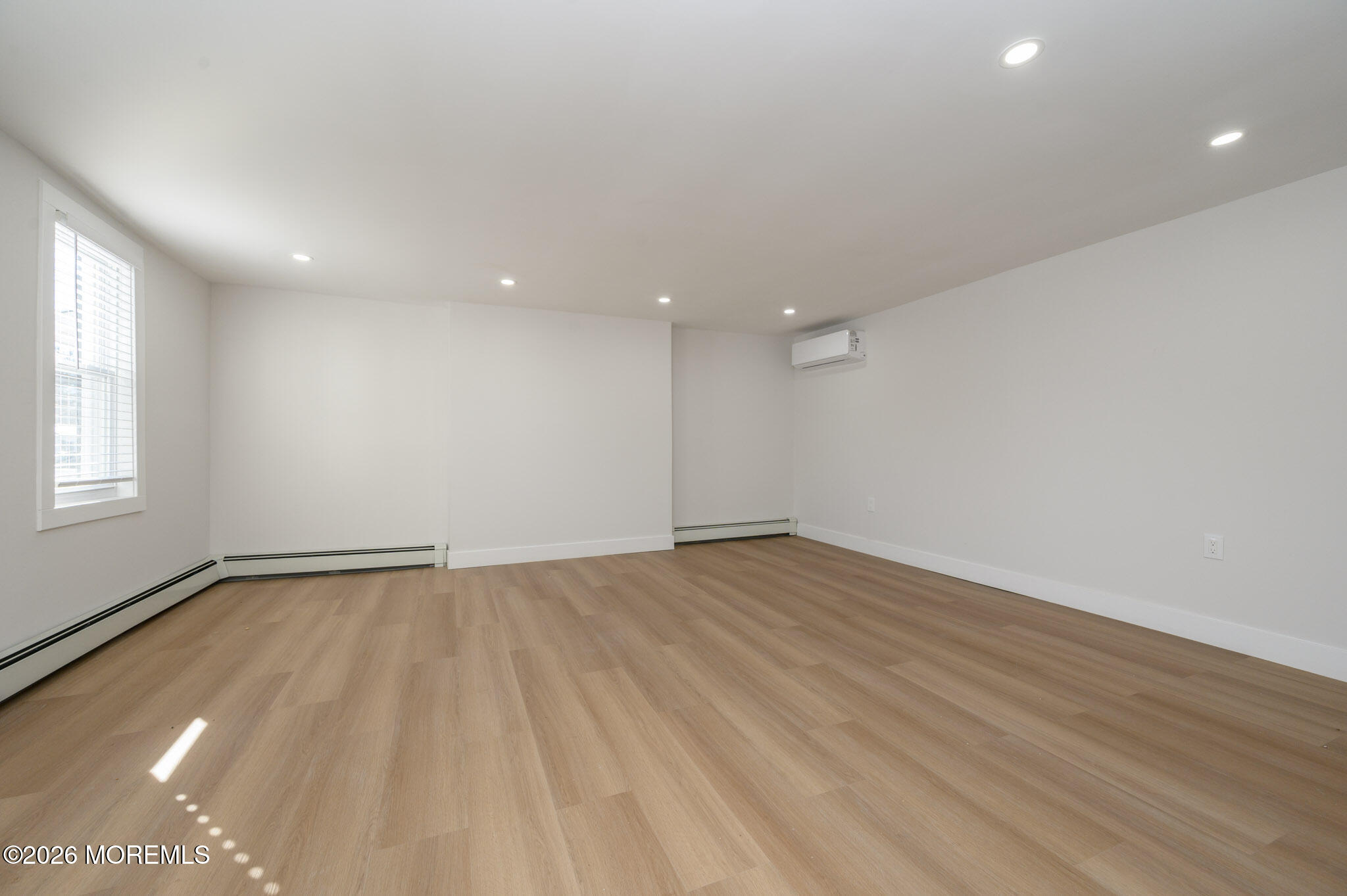8 Orchard Street Matawan, NJ 07747 - Photo 12 of 34 an empty room with wooden floor and windows