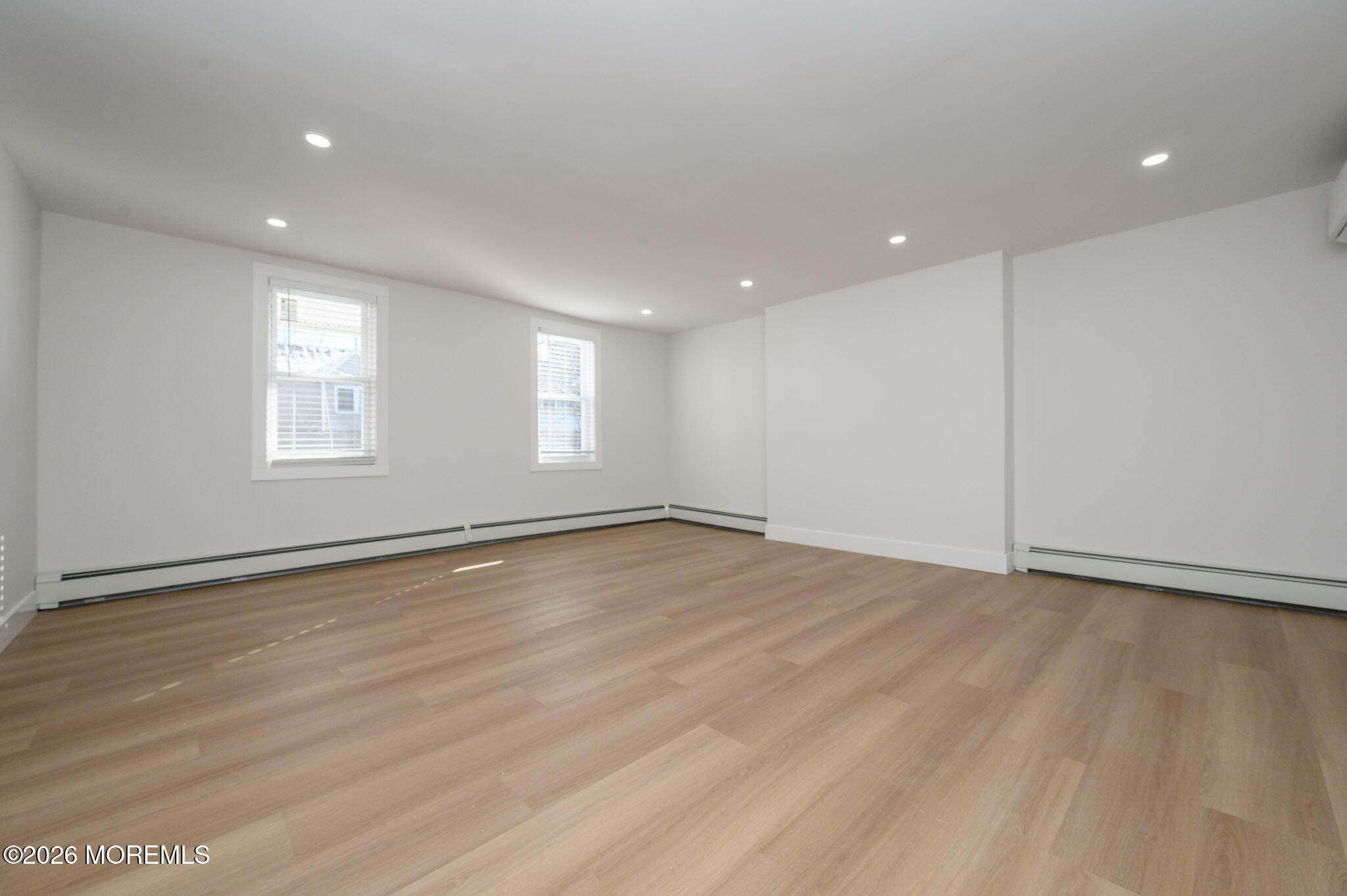 8 Orchard Street Matawan, NJ 07747 - Photo 13 of 34 an empty room with wooden floor and windows