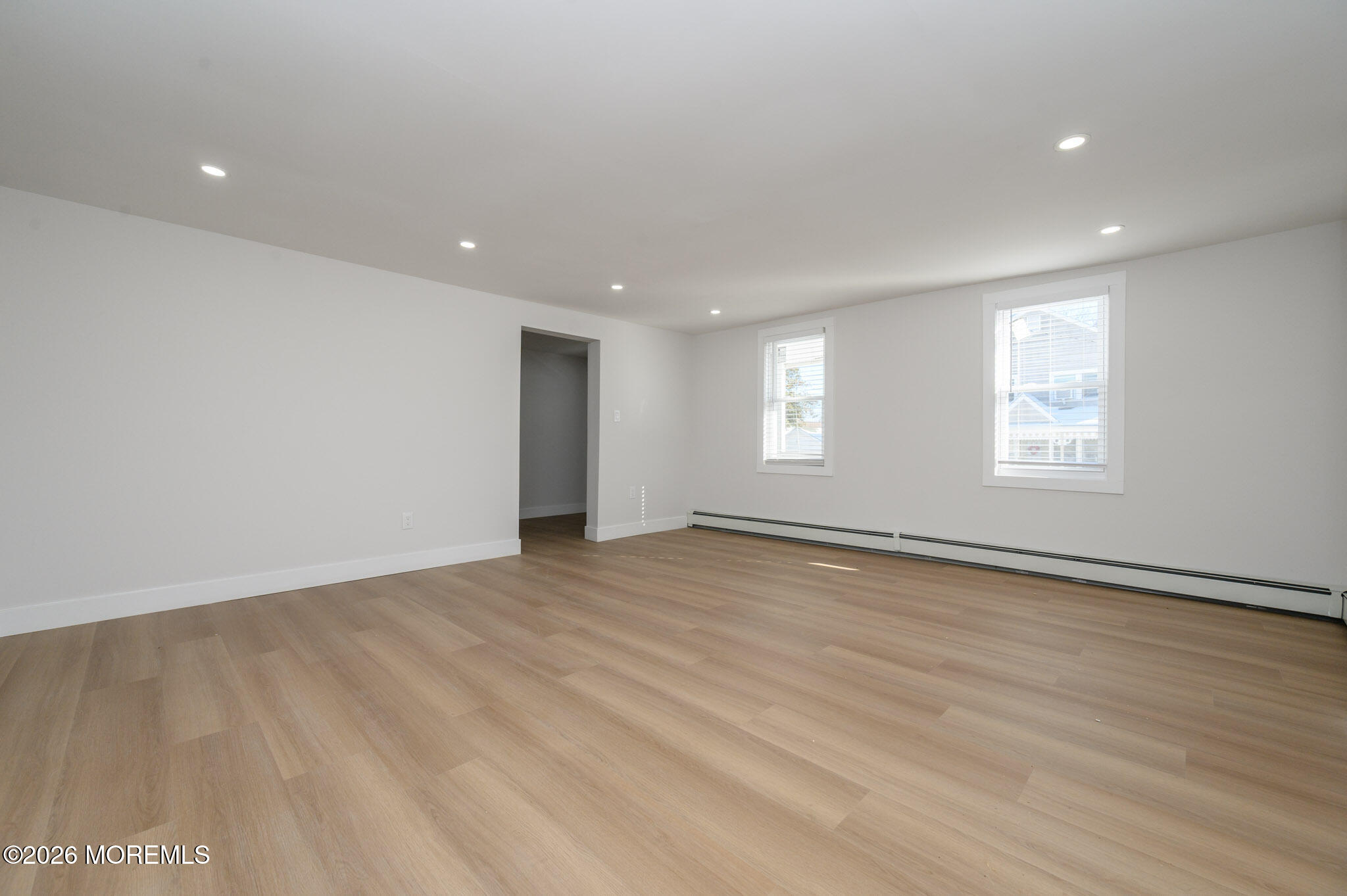 8 Orchard Street Matawan, NJ 07747 - Photo 14 of 34 an empty room with wooden floor and windows