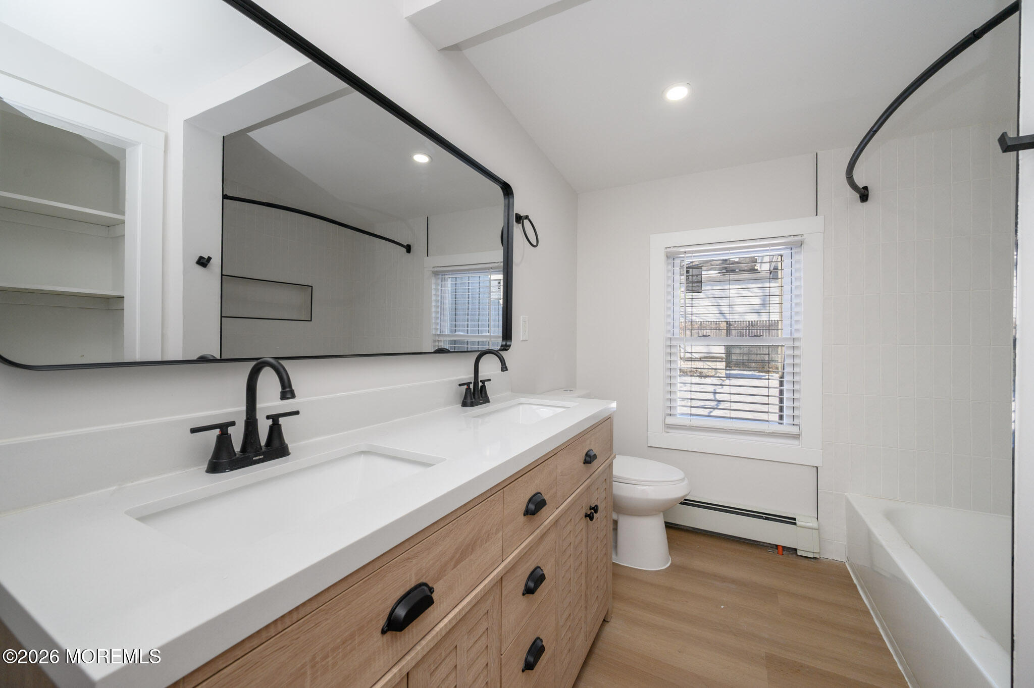 8 Orchard Street Matawan, NJ 07747 - Photo 21 of 34 a bathroom with a sink a toilet and a mirror