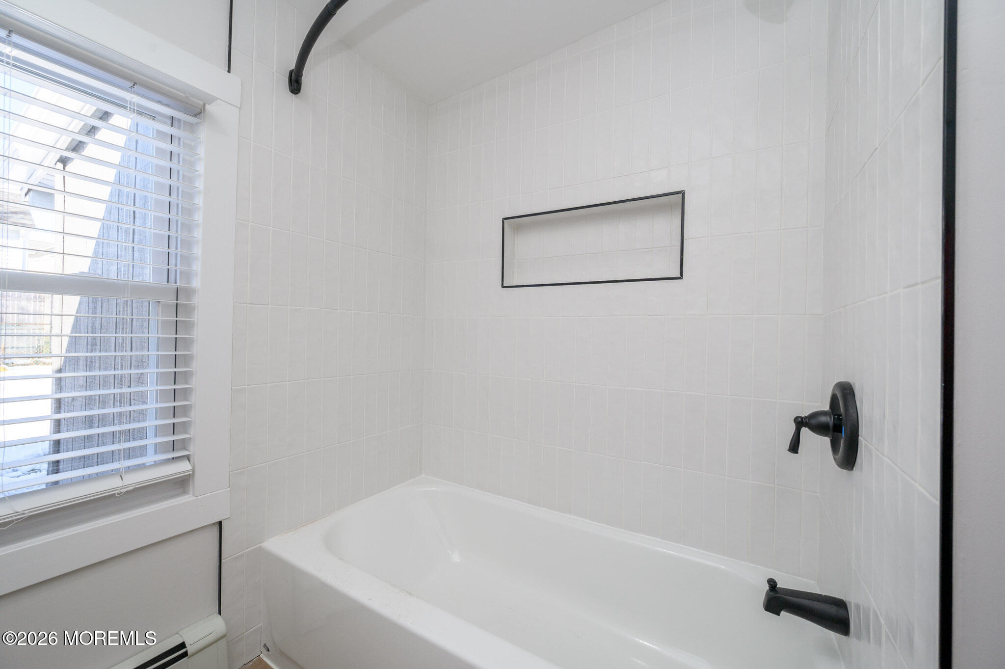 8 Orchard Street Matawan, NJ 07747 - Photo 22 of 34 a white bath tub sitting next to a window
