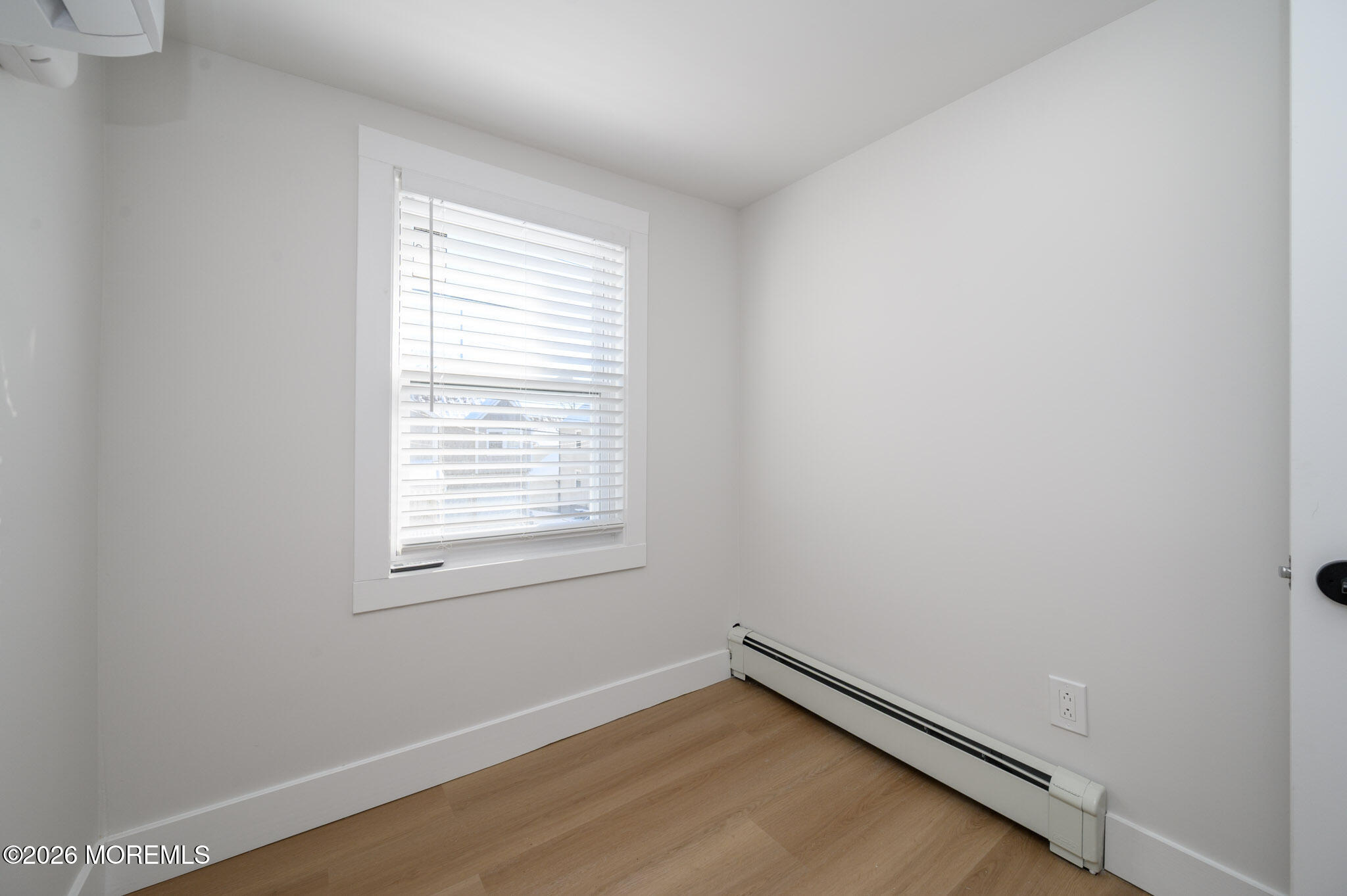 8 Orchard Street Matawan, NJ 07747 - Photo 24 of 34 an empty room with wooden floor and windows