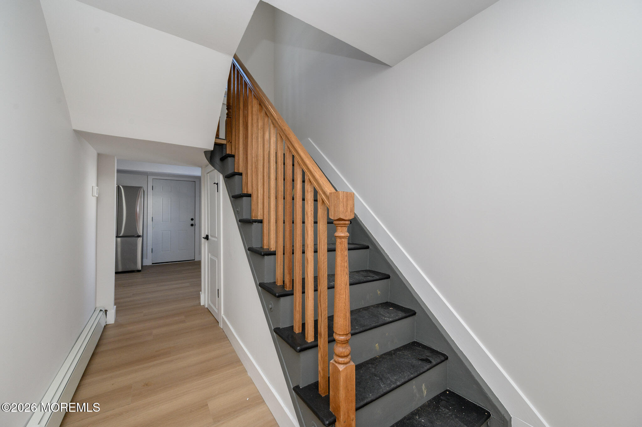 8 Orchard Street Matawan, NJ 07747 - Photo 3 of 34 a view of staircase with wooden floor and white walls