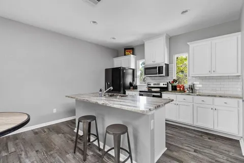 a room with furniture and a wooden floor