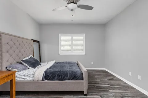 a living room with a bed and furniture