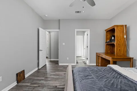 a bedroom with a bed and window