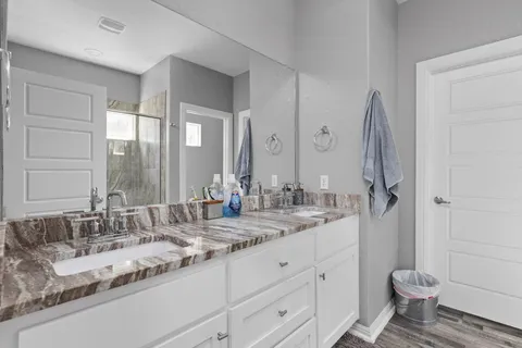 a bedroom with a bed and a dresser