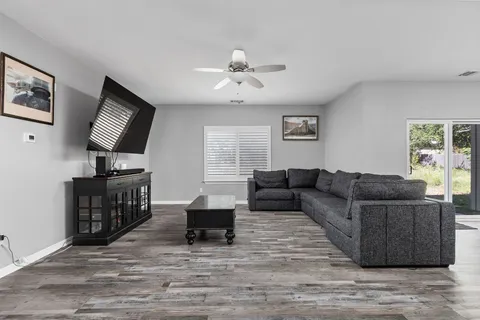 a view of a hallway with wooden staircase