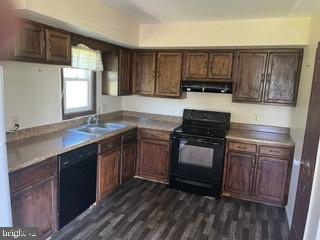 Cozy kitchen with rich wood accents.