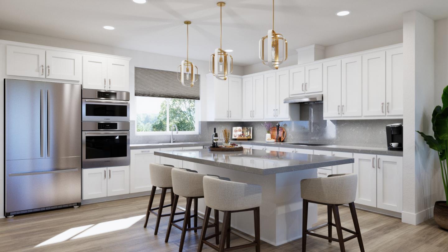 1006 Sinopia Terrace San Ramon, CA 94583 - Photo 3 of 12 a kitchen with stainless steel appliances granite countertop a kitchen island a stove a table and chairs