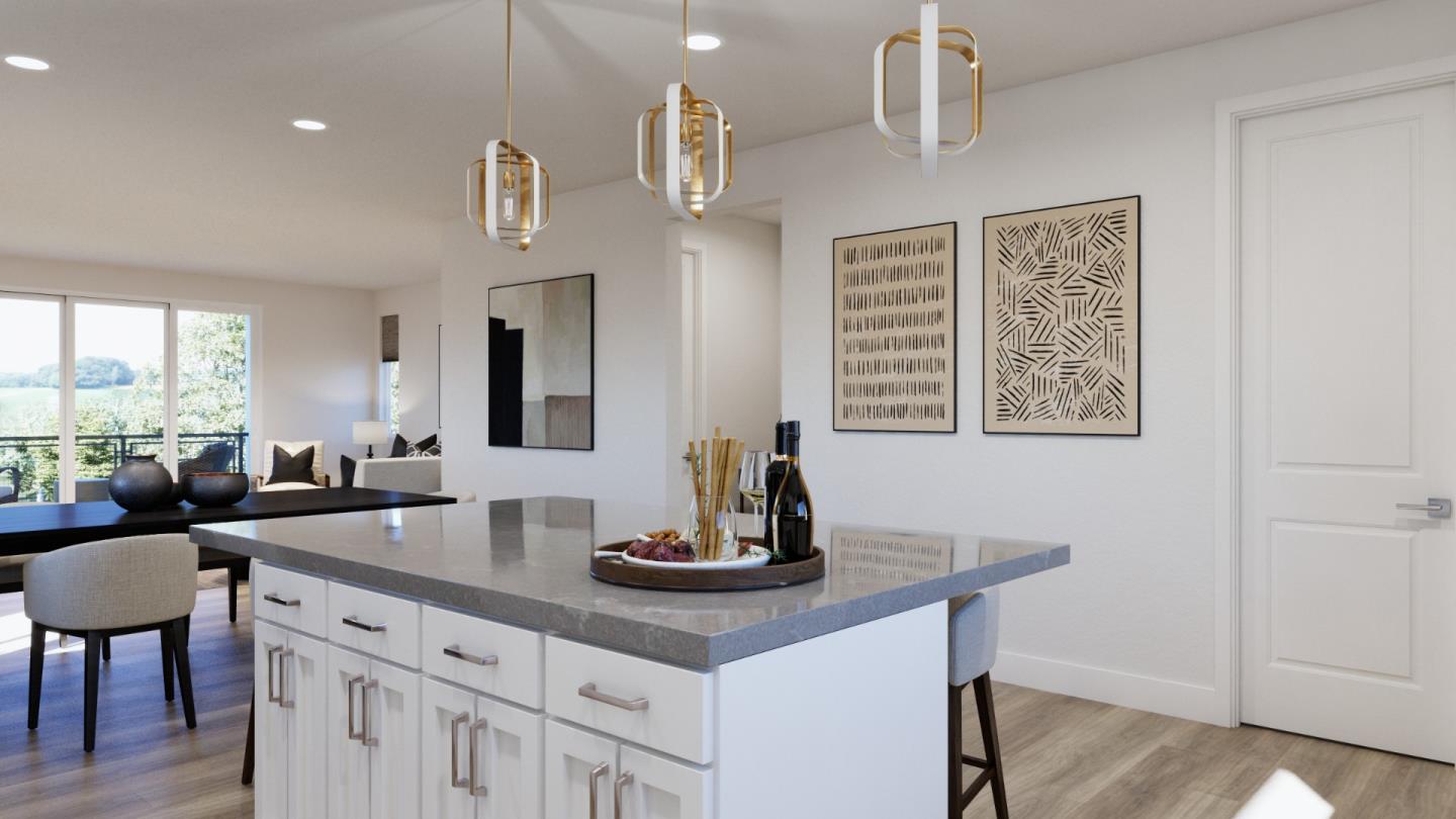 1006 Sinopia Terrace San Ramon, CA 94583 - Photo 4 of 12 a kitchen with a sink dishwasher a dining table and chairs with wooden floor