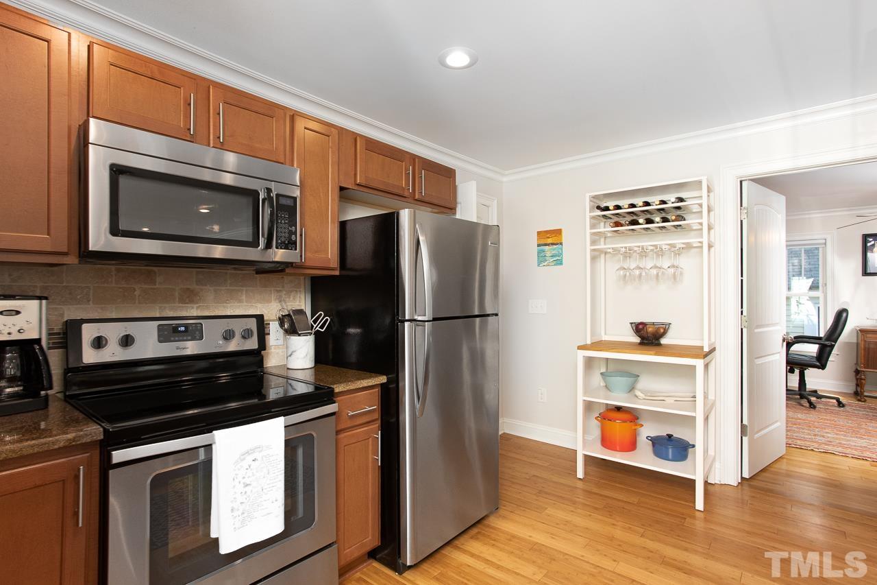1509 South Roxboro Street Durham, NC 27707 - Photo 11 of 30 a kitchen with stainless steel appliances granite countertop a refrigerator stove and microwave