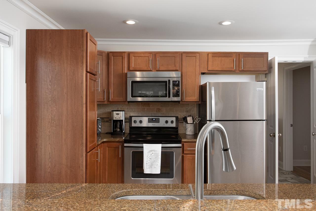 1509 South Roxboro Street Durham, NC 27707 - Photo 12 of 30 a kitchen with a refrigerator and a microwave