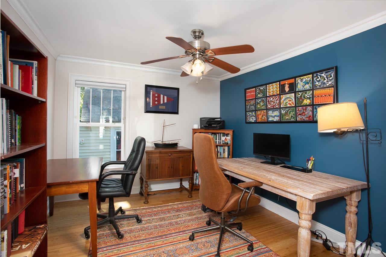 1509 South Roxboro Street Durham, NC 27707 - Photo 18 of 30 a workspace with furniture bookshelf and a window