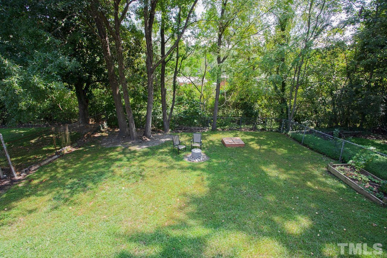 1509 South Roxboro Street Durham, NC 27707 - Photo 28 of 30 a backyard of a house with lots of green space