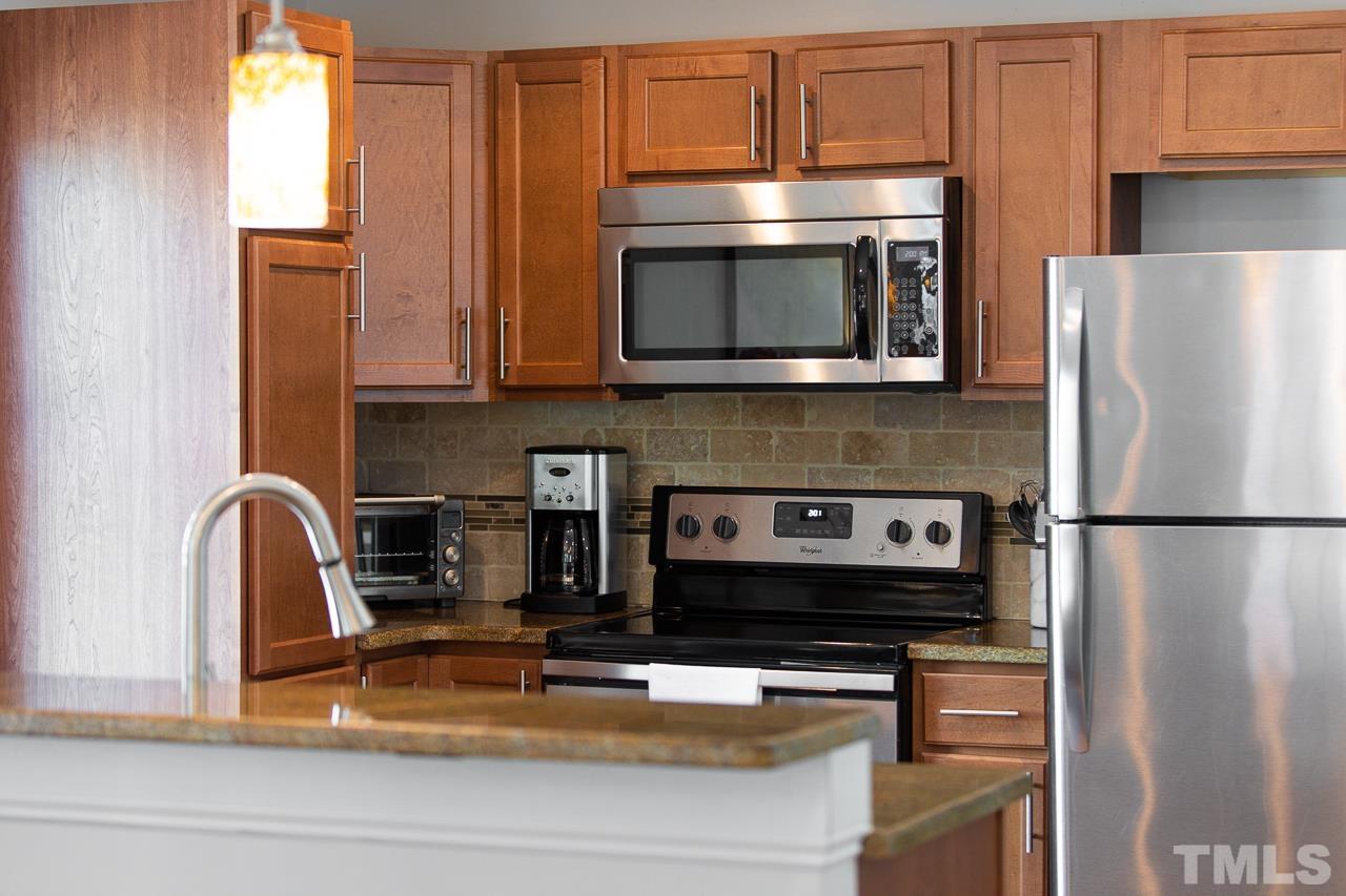 1509 South Roxboro Street Durham, NC 27707 - Photo 9 of 30 a kitchen with appliances a microwave and cabinets