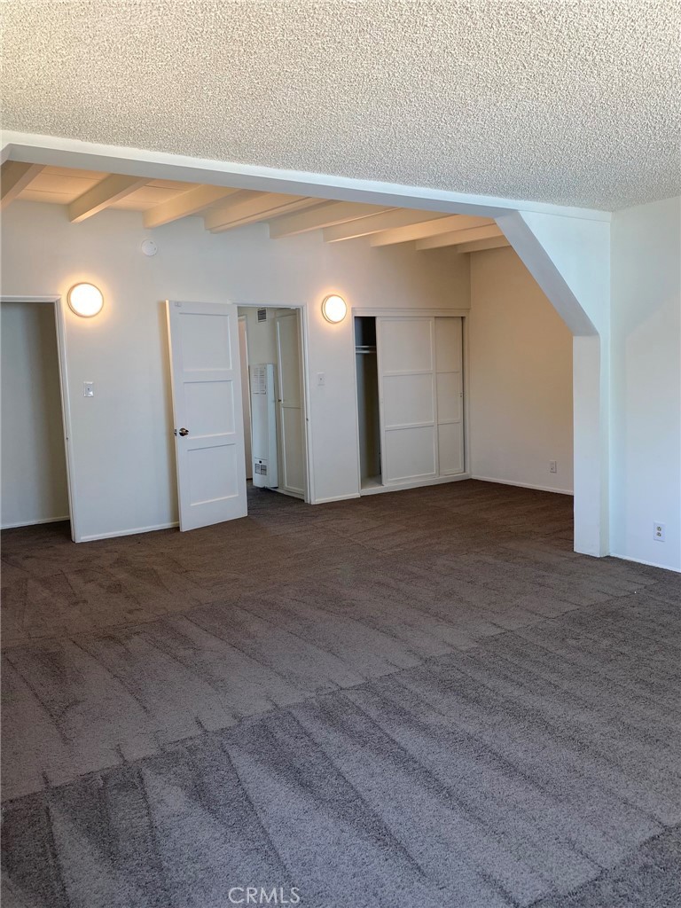 1713 West 165th Street Compton, CA 90220 - Photo 7 of 13 Primary bedroom looking back toward doors. Yes, it could be turned into two bedrooms.