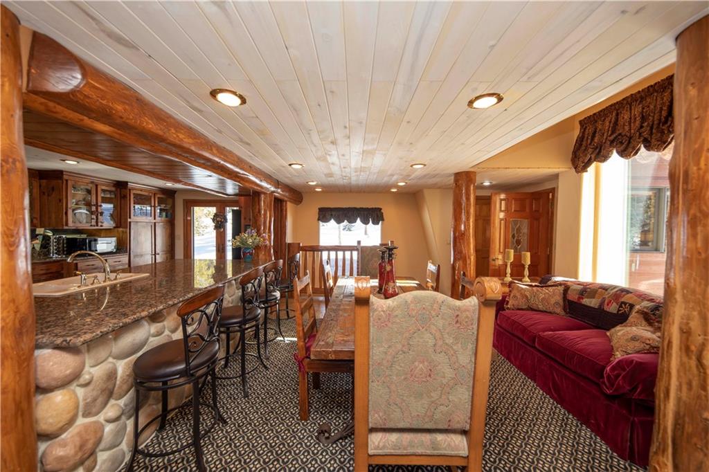 183 County Road 534 Breckenridge, CO 80424 - Photo 11 of 34 a living room with furniture a chandelier and large windows