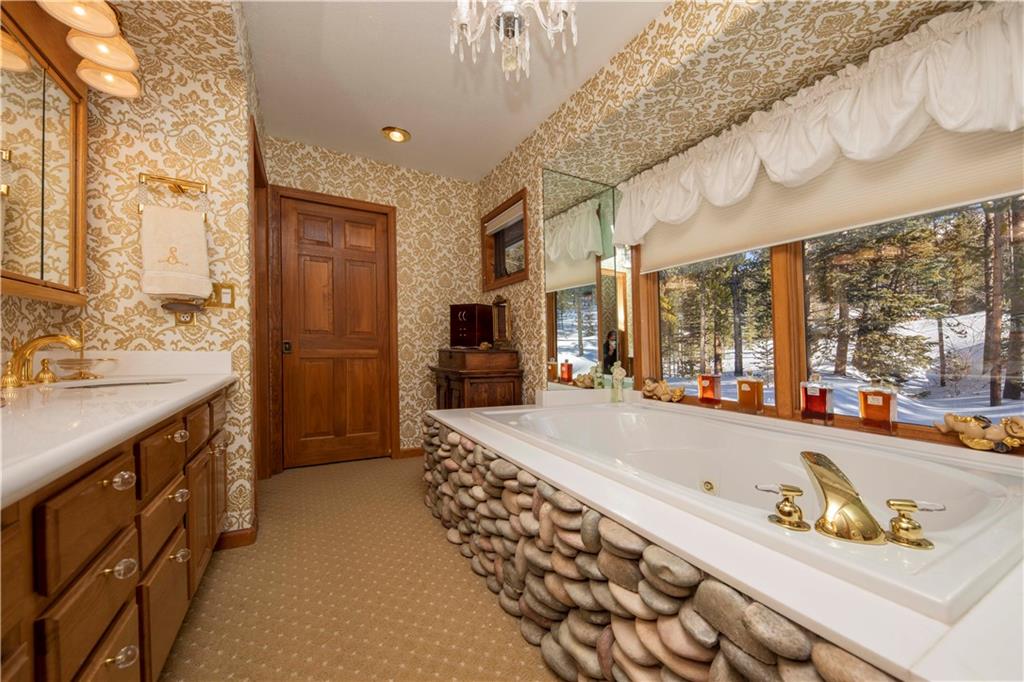 183 County Road 534 Breckenridge, CO 80424 - Photo 15 of 34 a spacious bathroom with a tub sink and mirror
