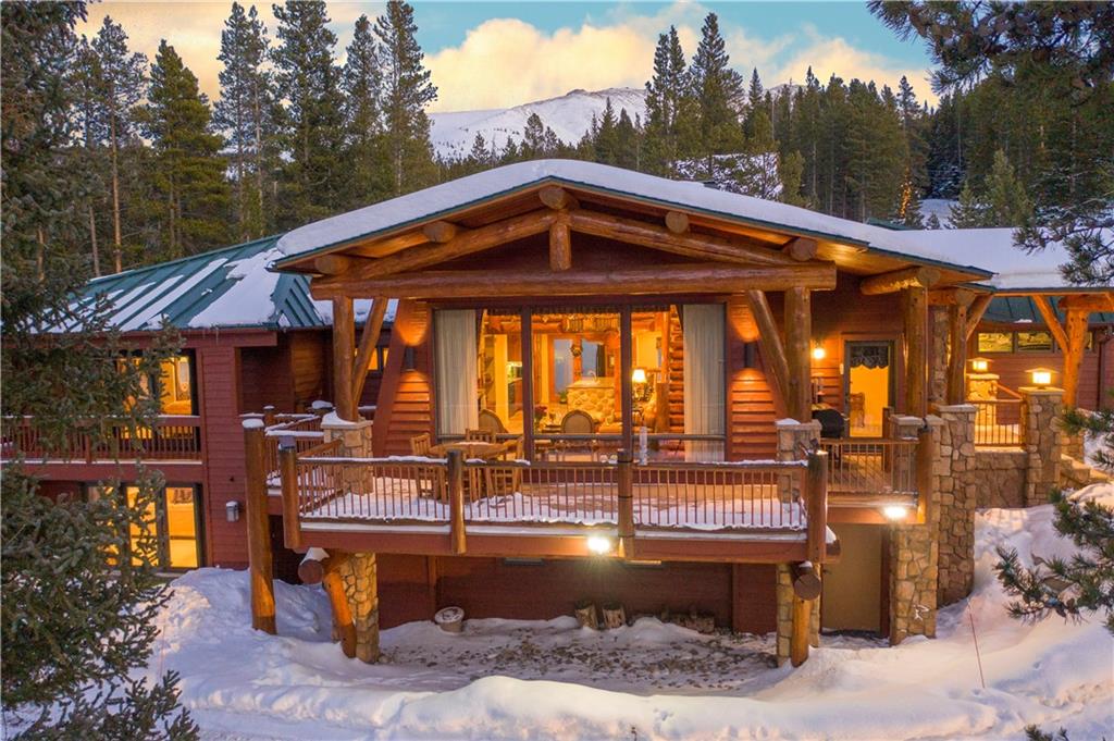 183 County Road 534 Breckenridge, CO 80424 - Photo 2 of 34 a view of a roof deck with table and chairs with wooden floor and fence