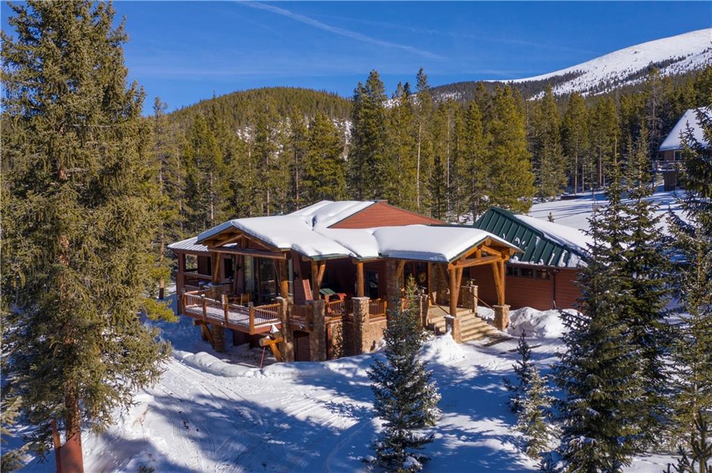 183 County Road 534 Breckenridge, CO 80424 - Photo 3 of 34 a view of a patio with a table and chairs under an umbrella