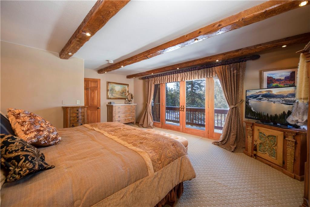 183 County Road 534 Breckenridge, CO 80424 - Photo 23 of 34 a bed room with a bed and a large window