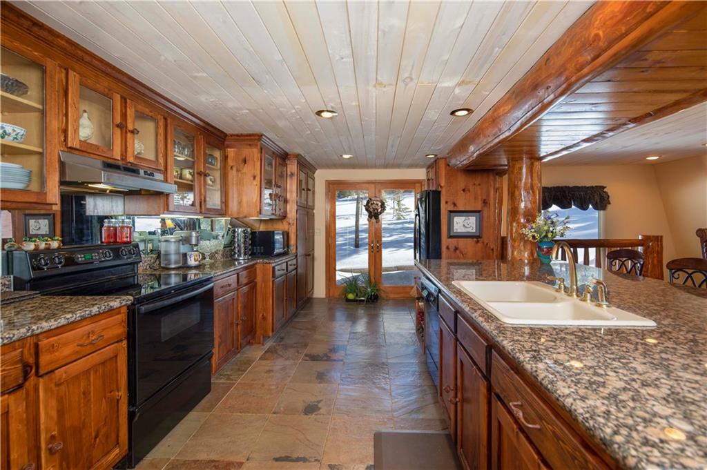 183 County Road 534 Breckenridge, CO 80424 - Photo 7 of 34 a kitchen with stainless steel appliances granite countertop a sink and stove