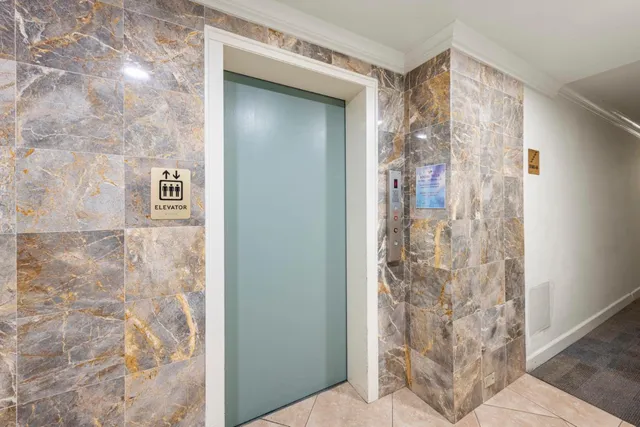 a view of a hallway with an entryway