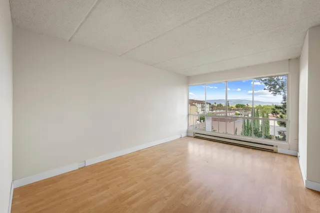 a bed room with a bed and a large window