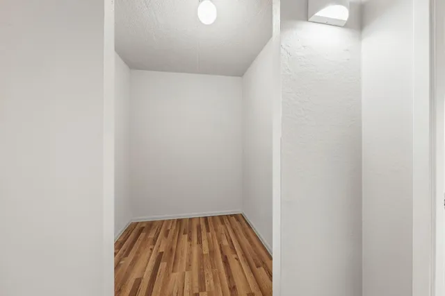 an aerial view of a house with a backyard