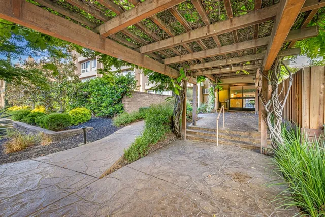 a view of a livingroom with workspace and a window
