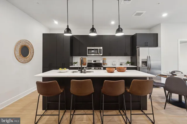 a kitchen with a table and chairs in it