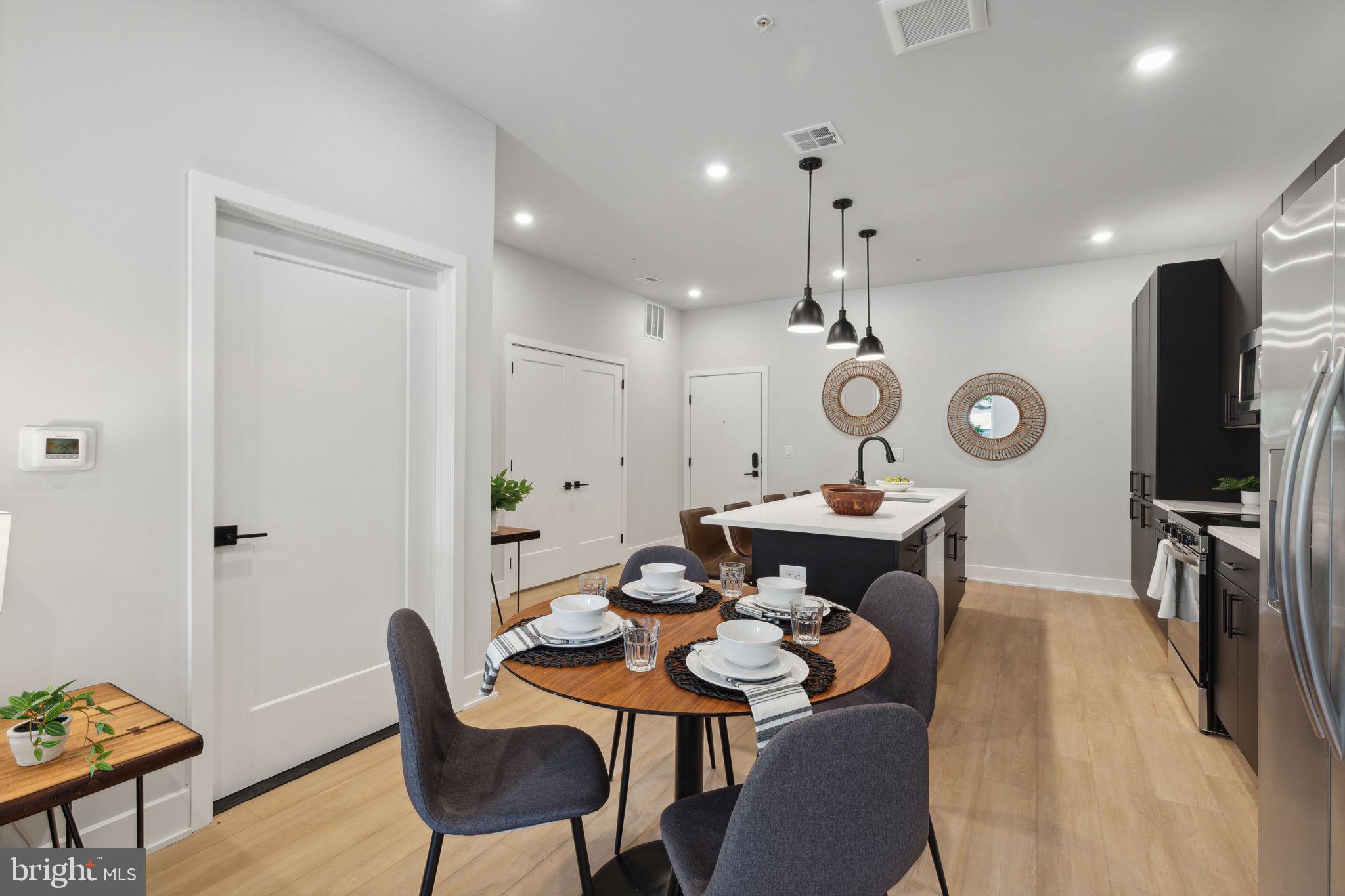 6910 Ridge Avenue, Unit 220 Philadelphia, PA 19128 - Photo 7 of 25 a view of a dining room with furniture