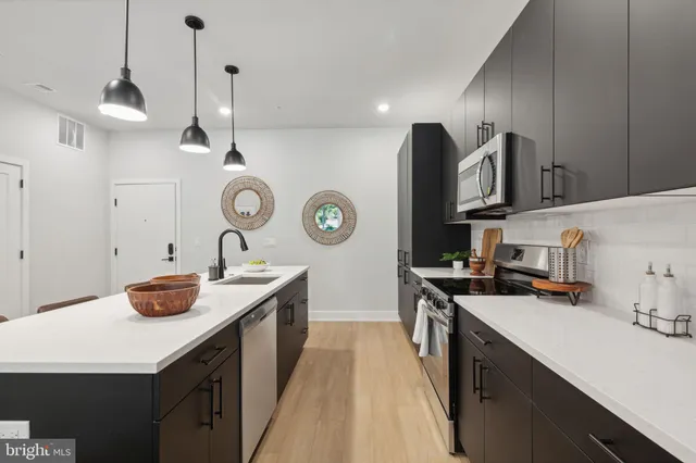 a kitchen with a sink and cabinets