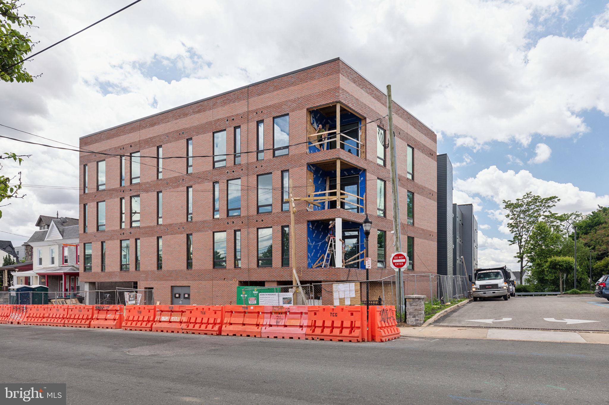 6910 Ridge Avenue, Unit 220 Philadelphia, PA 19128 - Photo 9 of 25 a view of building with lot of street