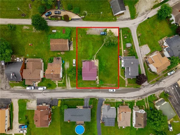 an aerial view of house with yard swimming pool and outdoor seating