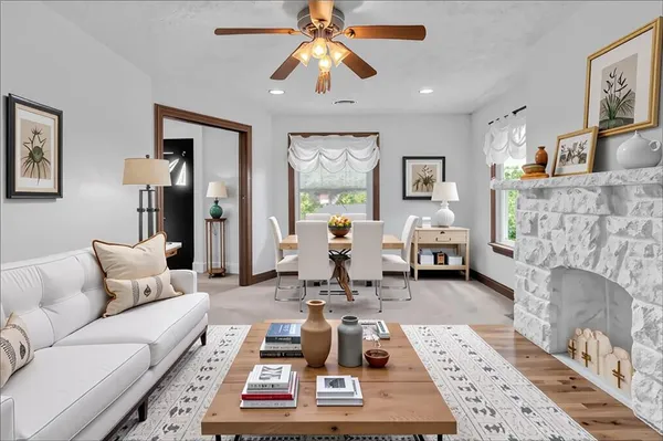 a living room with furniture and a fireplace