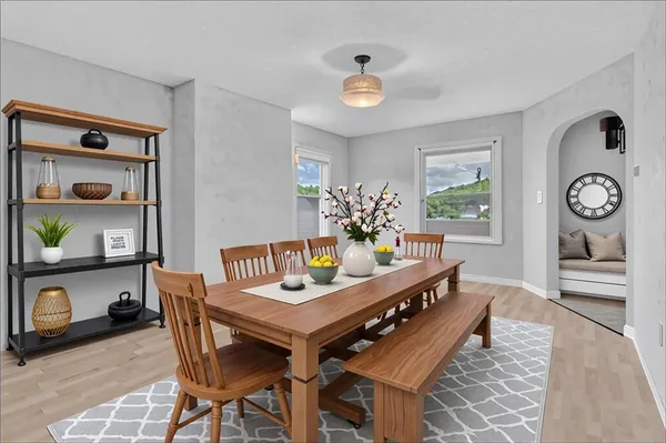 a dining room with furniture and window