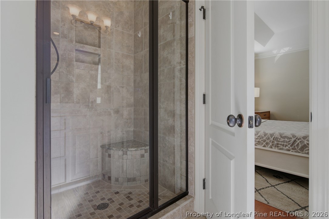 14 Spring Water Court Spring Lake, NC 28390 - Photo 12 of 34 a bathroom with a tub shower and sink