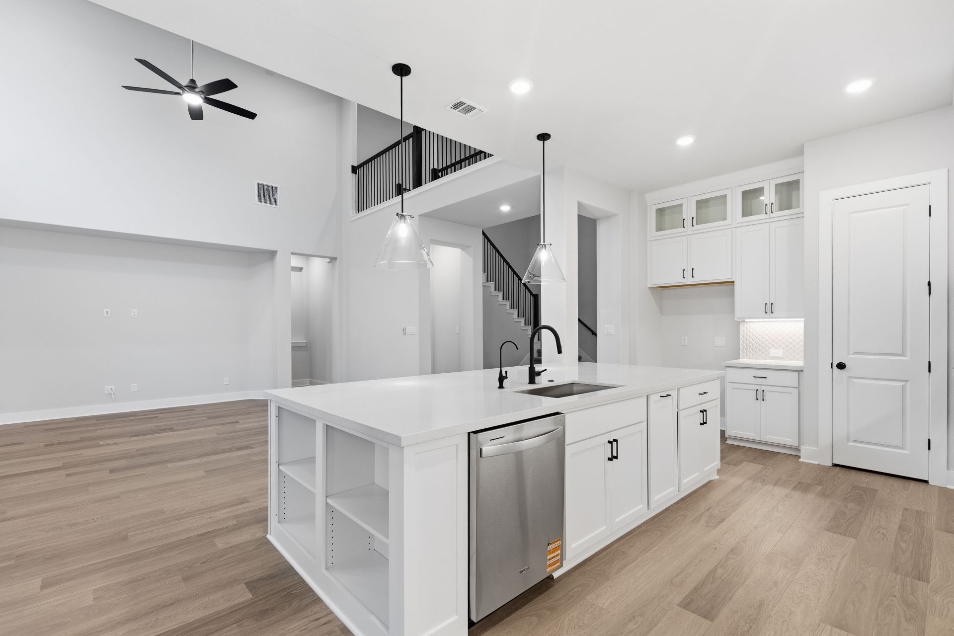 1713 Snowdrop Drive Georgetown, TX 78628 - Photo 11 of 35 a kitchen with a stove a sink and wooden floor
