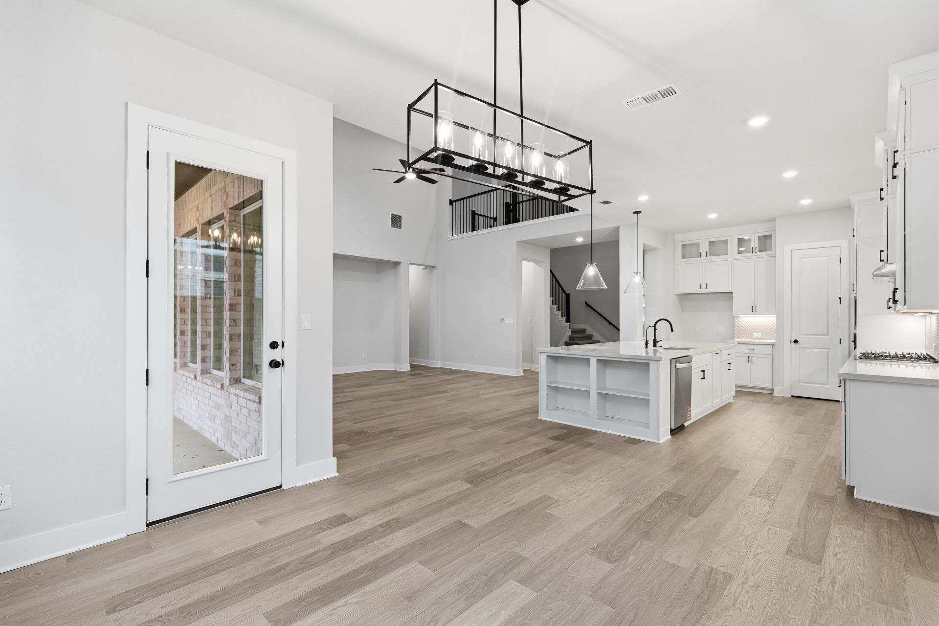 1713 Snowdrop Drive Georgetown, TX 78628 - Photo 13 of 35 a view of a kitchen with cabinets and wooden floor