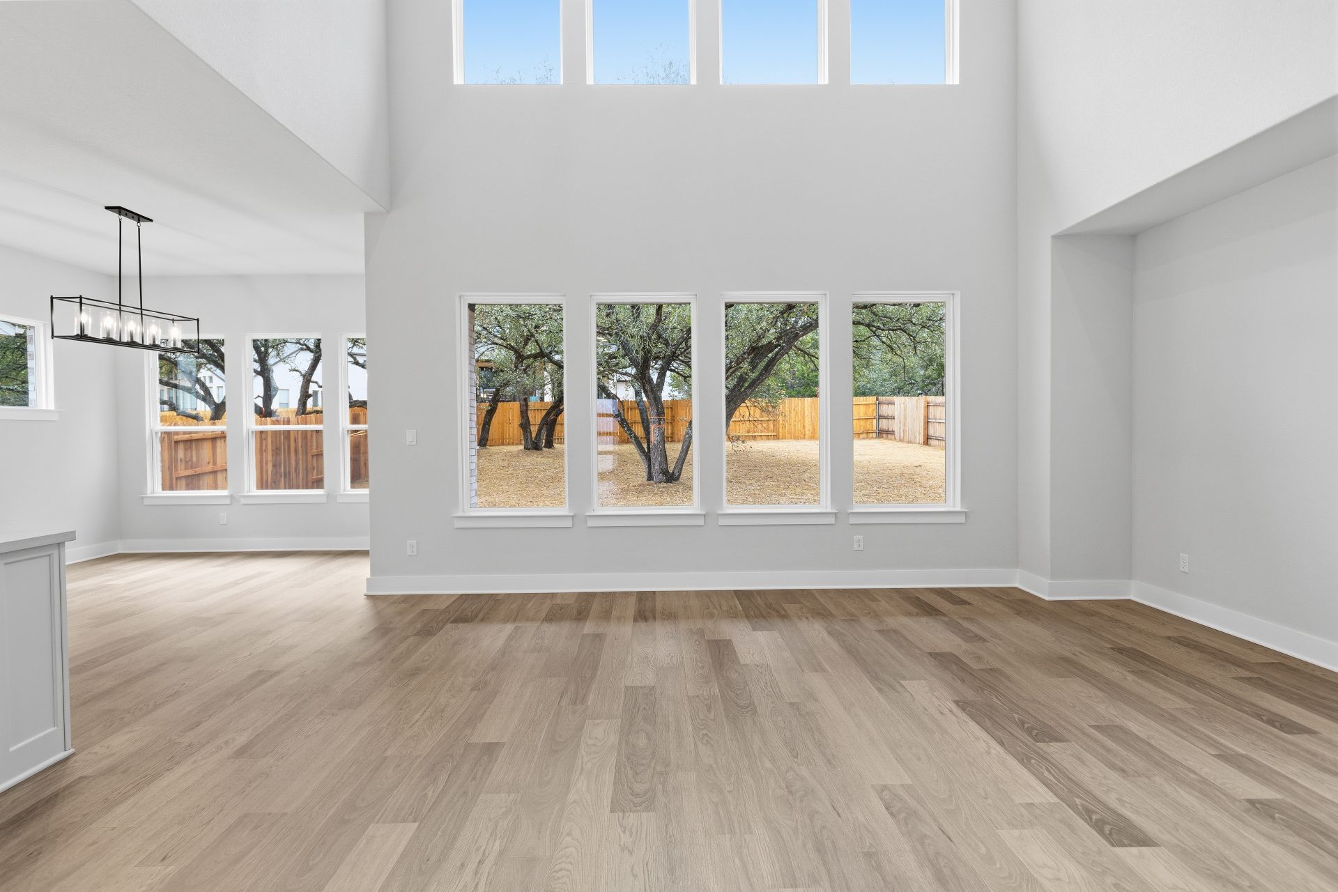 1713 Snowdrop Drive Georgetown, TX 78628 - Photo 14 of 35 a view of empty room with wooden floor and fan