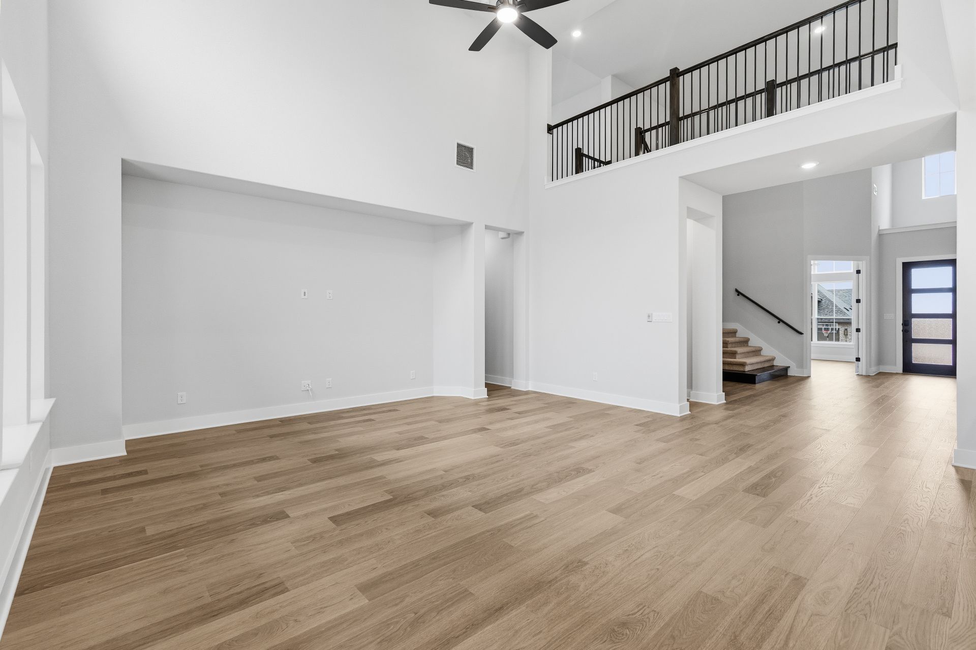 1713 Snowdrop Drive Georgetown, TX 78628 - Photo 15 of 35 a view of a livingroom with wooden floor and stairs