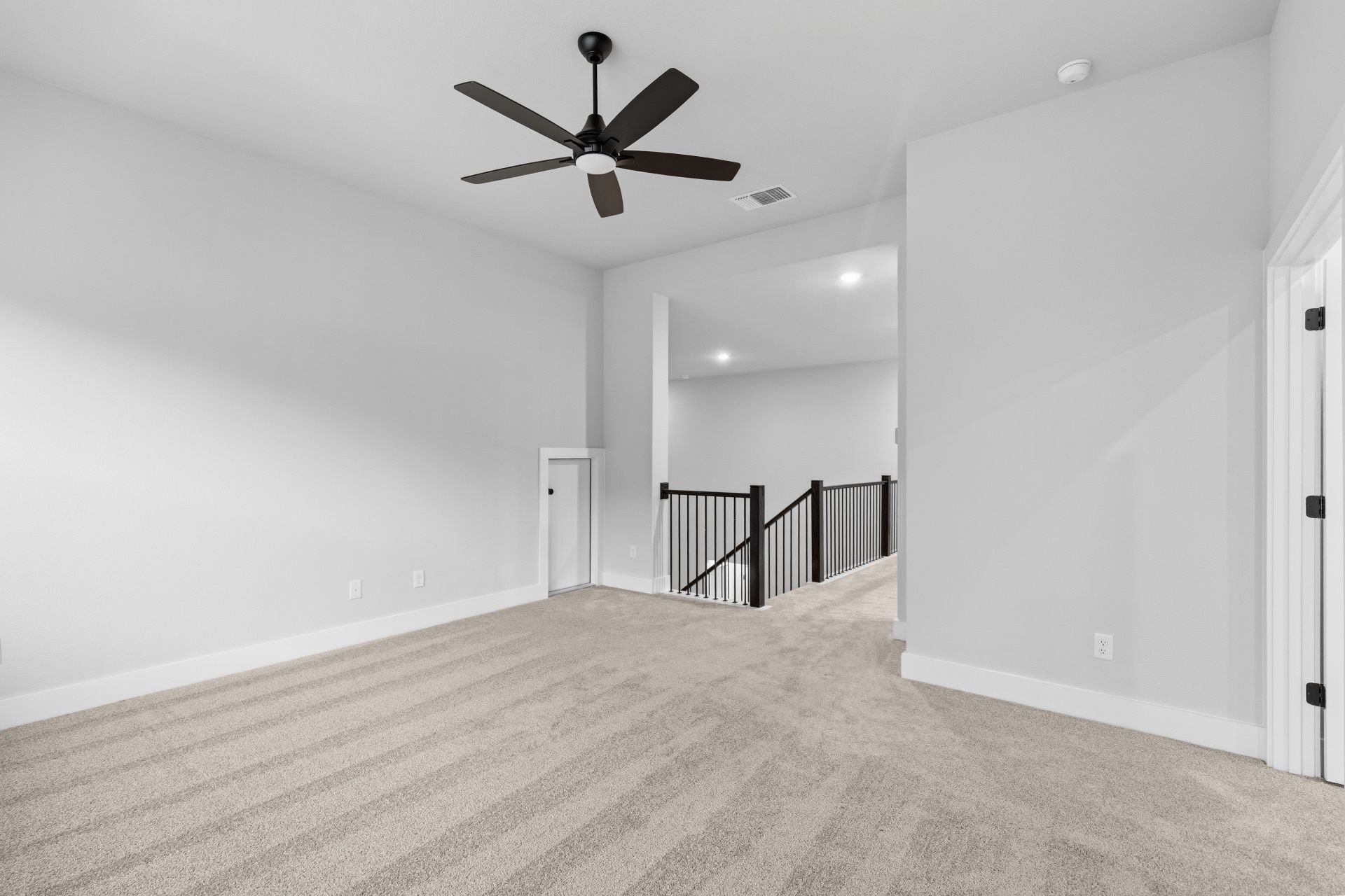 1713 Snowdrop Drive Georgetown, TX 78628 - Photo 24 of 35 an empty room with wooden floor and a ceiling fan