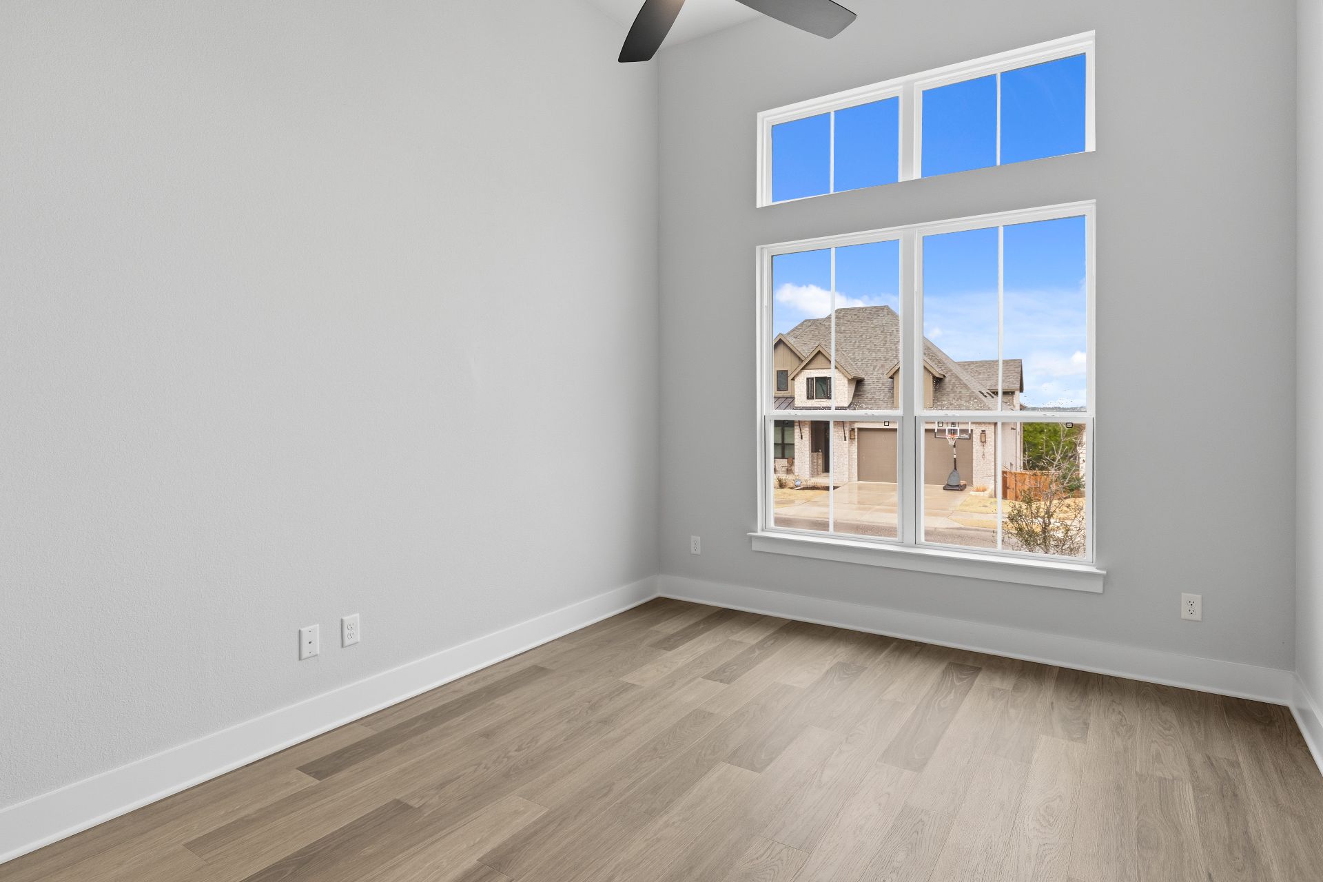 1713 Snowdrop Drive Georgetown, TX 78628 - Photo 27 of 35 a view of an empty room with wooden floor and window
