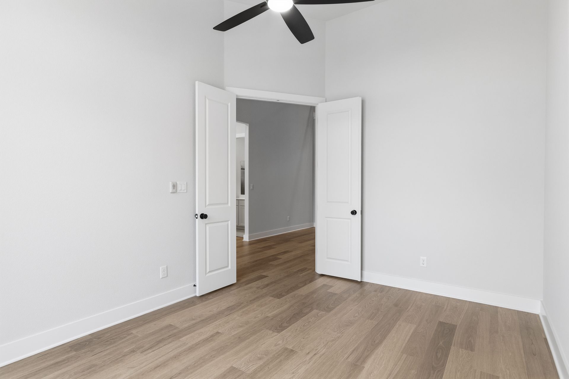 1713 Snowdrop Drive Georgetown, TX 78628 - Photo 28 of 35 an empty room with wooden floor cabinet and ceiling fan