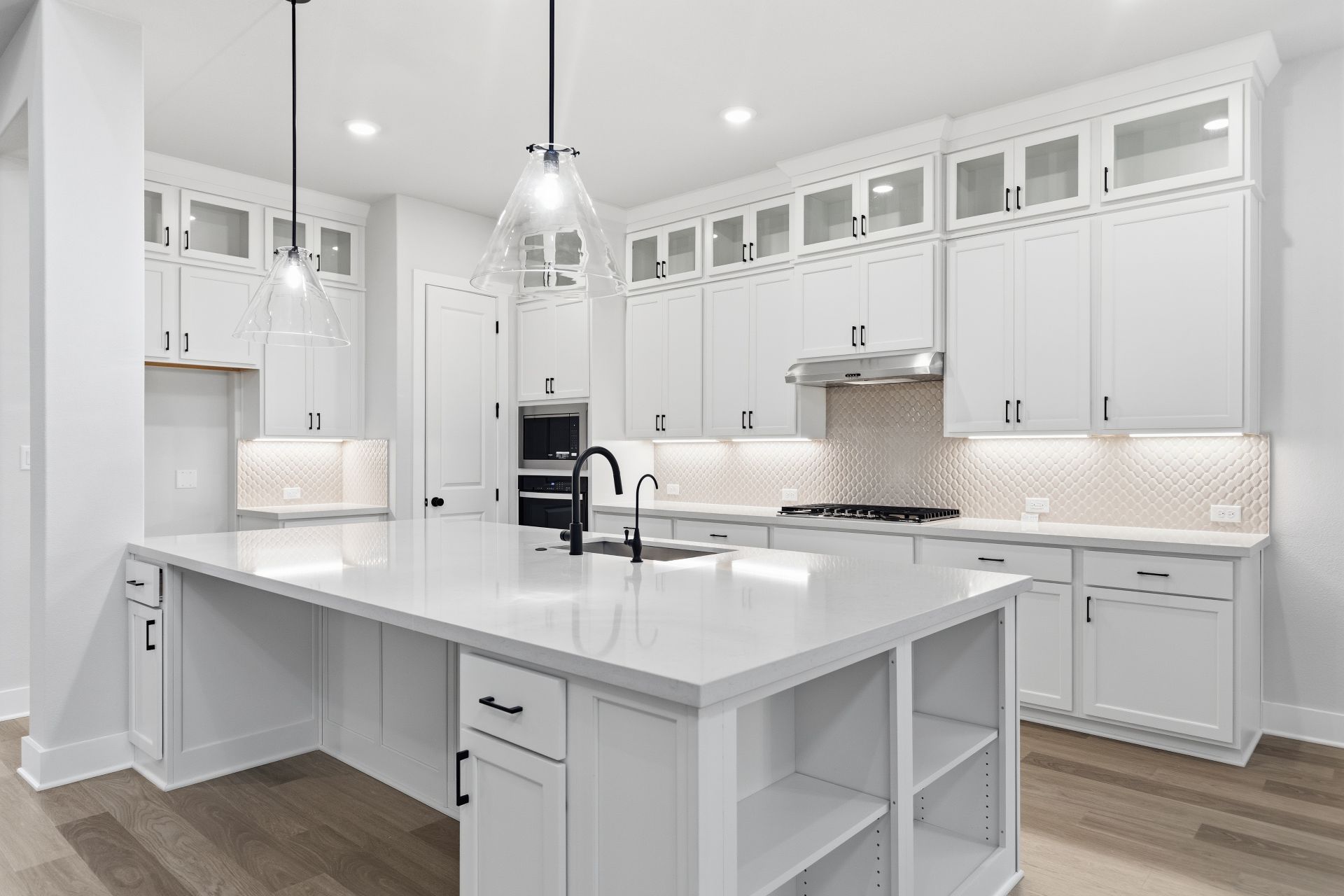 1713 Snowdrop Drive Georgetown, TX 78628 - Photo 8 of 35 a kitchen with white cabinets and white appliances