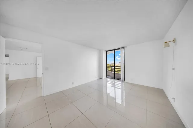 a bathroom with a granite countertop toilet sink and mirror